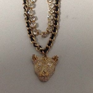 Ladies necklace in gold tone with black.